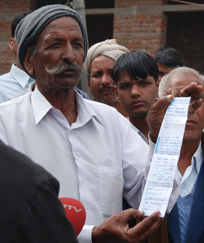 Farmer in Kala Dera Shows Increased Electric Bill from Pumping Water
